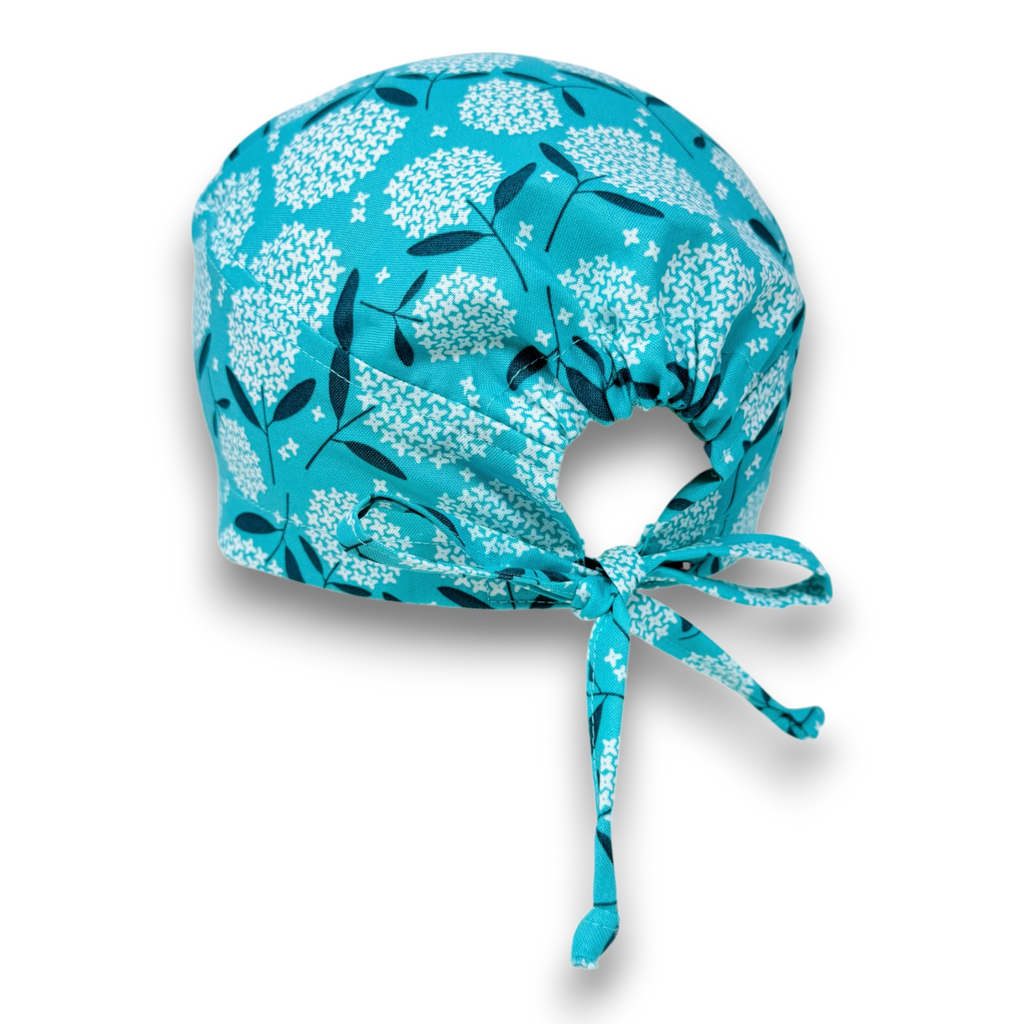 Surgical scrub hat. Teal hydrangea Skull tie-back style surgical scrub cap by Paradise Caps.