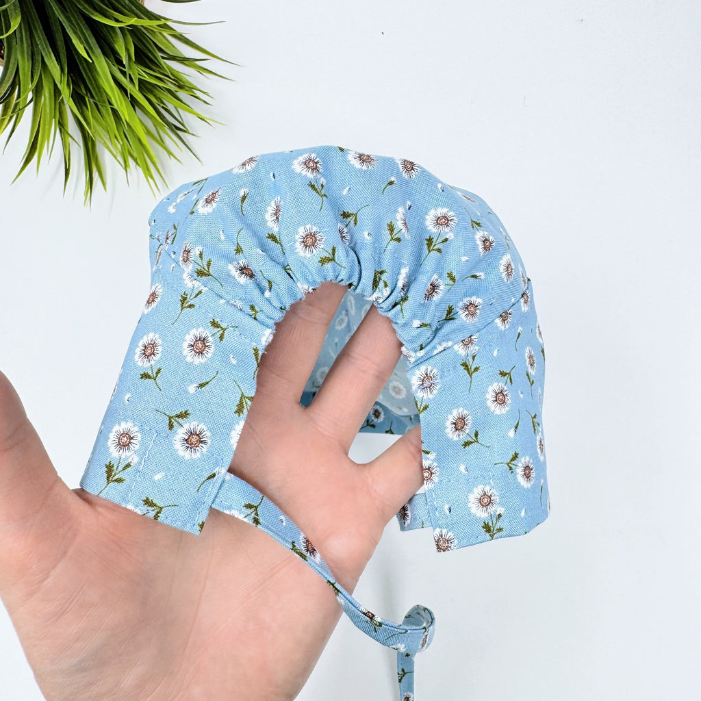 Tossed Daises Skull tie-back style surgical scrub cap for men by Paradise Caps.