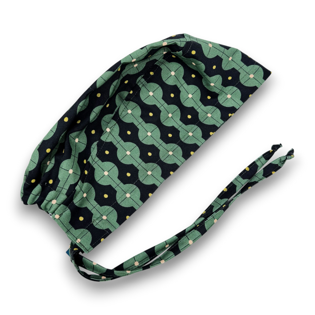 Men's surgical scrub cap. Green Geometric skull tie-back style scrub hat by Paradise Caps.