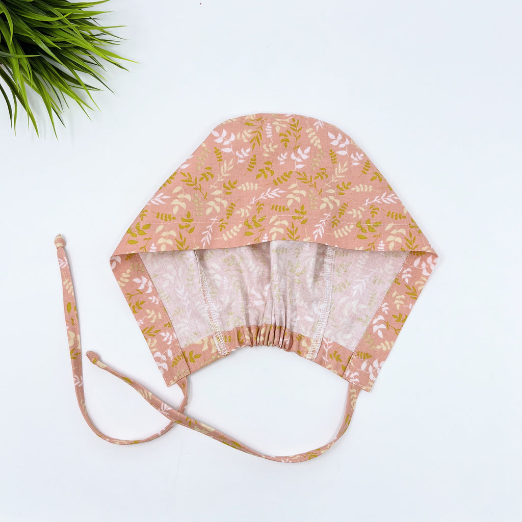 Coral leaves Skull tie-back style surgical scrub cap by Paradise Caps.