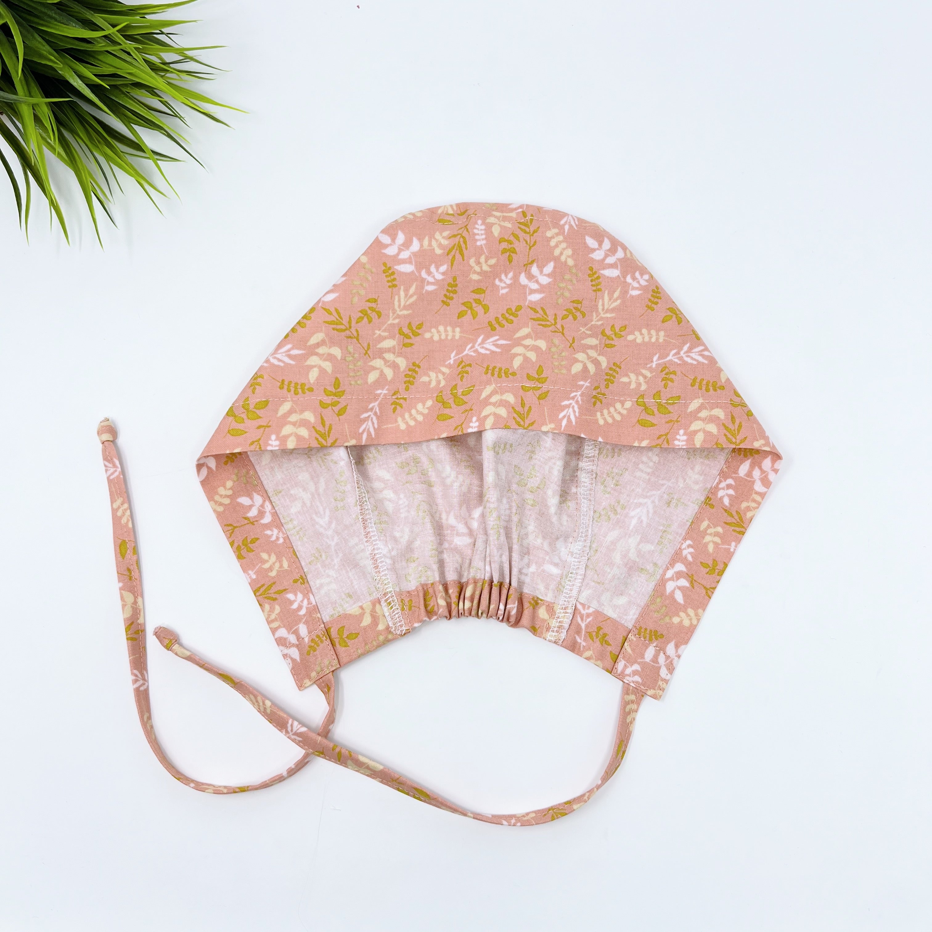Coral leaves Skull tie-back style surgical scrub cap by Paradise Caps.