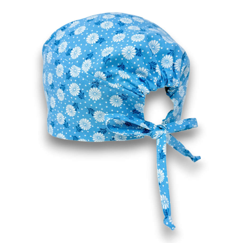 Surgical scrub hat. Daisy print Skull tie-back style surgical scrub cap by Paradise Caps.