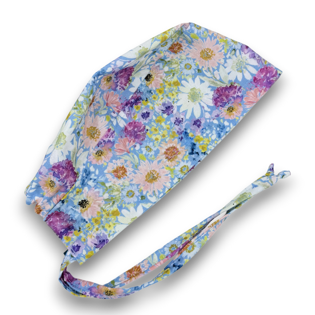 Watercolor Floral skull tie-back style surgical scrub cap by Paradise Caps.