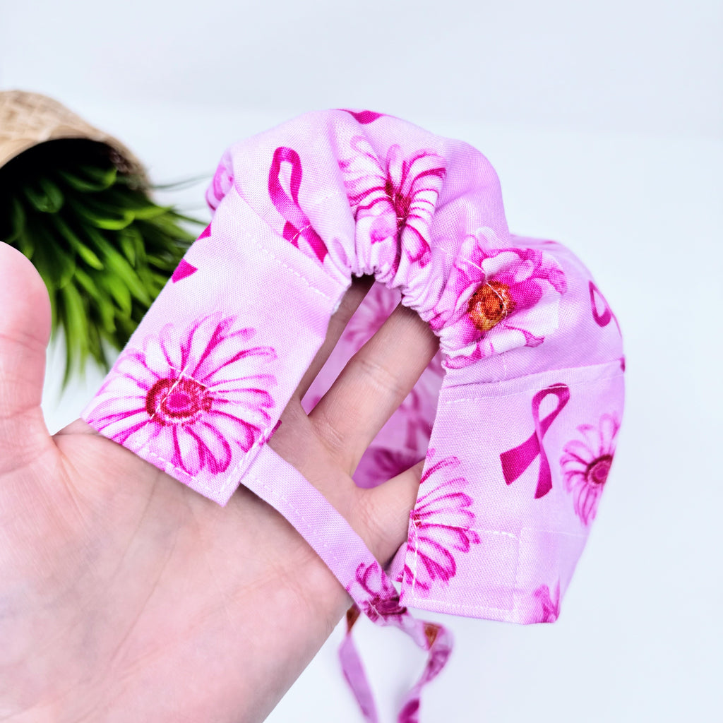 Pink Flower Skull tie-back style surgical scrub cap for men by Paradise Caps.