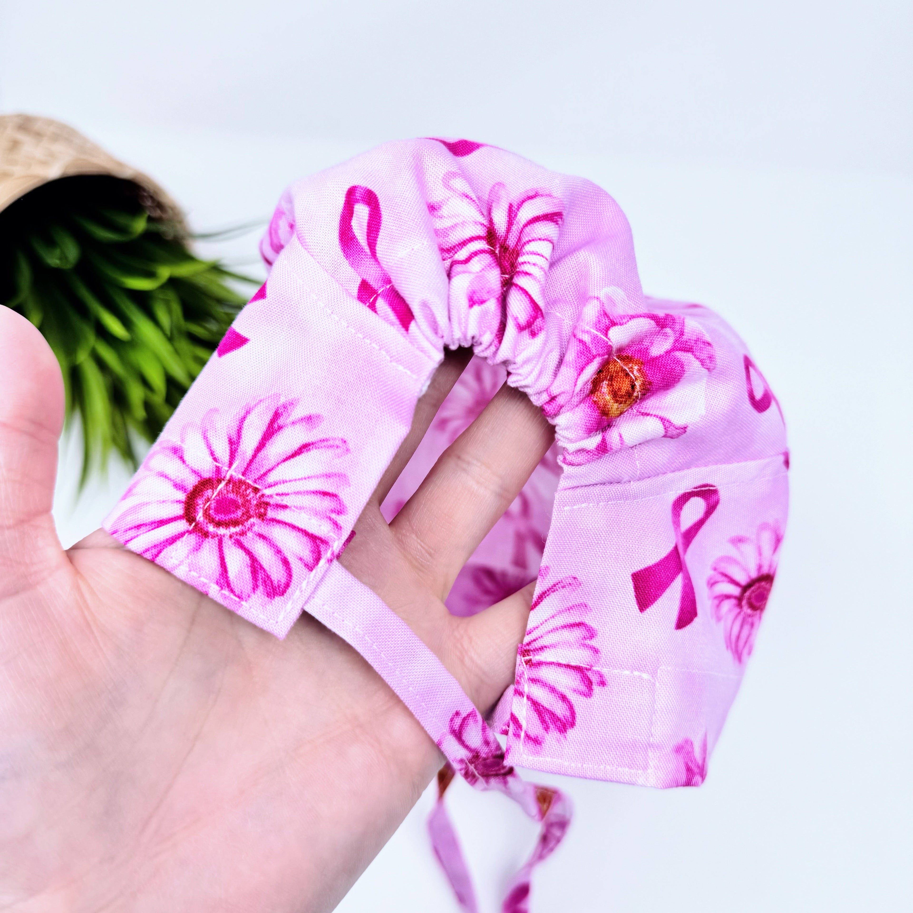 Pink Flower Skull tie-back style surgical scrub cap for men by Paradise Caps.