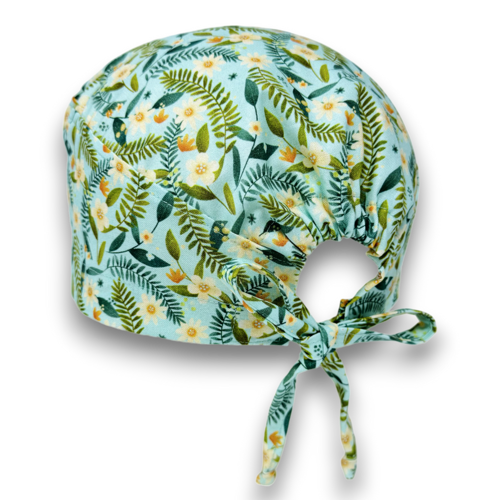 Floral Skull tie-back style surgical scrub cap by Paradise Caps. Mint