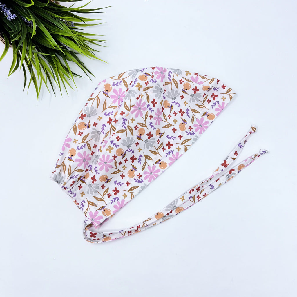 Colorful Blooming Skull tie-back style surgical scrub cap for men by Paradise Caps.