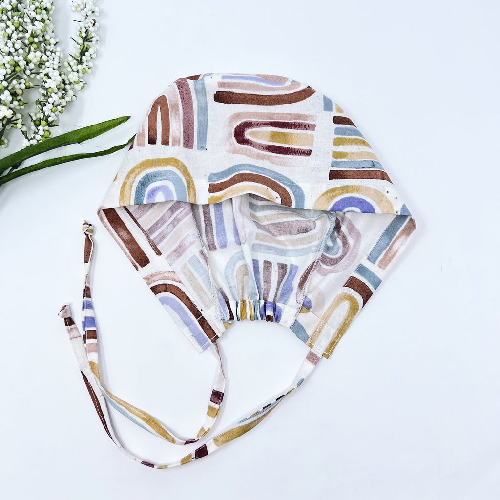 Rainbow Skull tie-back style surgical scrub cap for men by Paradise Caps.