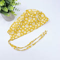 Yellow Flower Skull tie-back style surgical scrub cap for men by Paradise Caps.