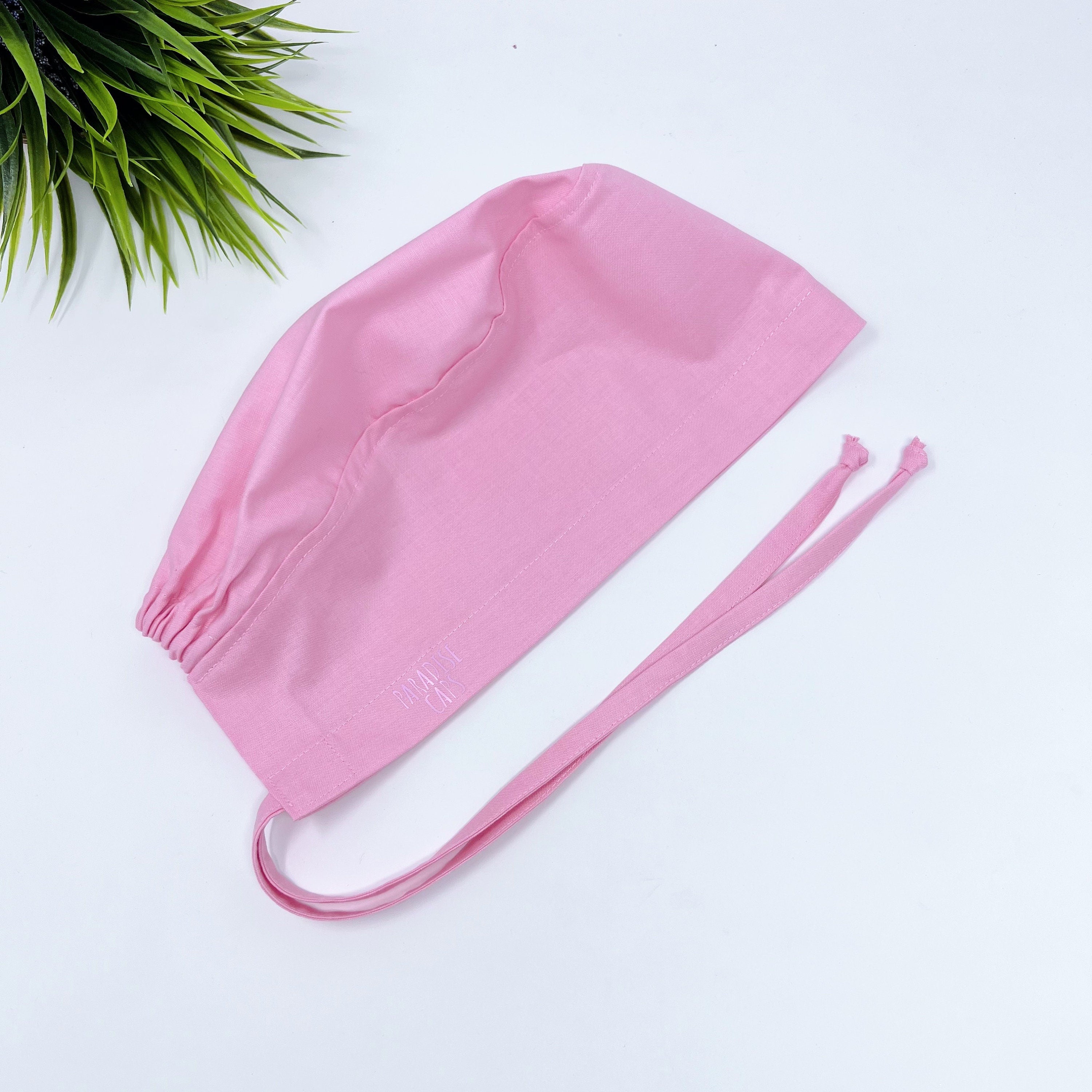 Solid pink Skull tie-back style surgical scrub cap for men by Paradise Caps.