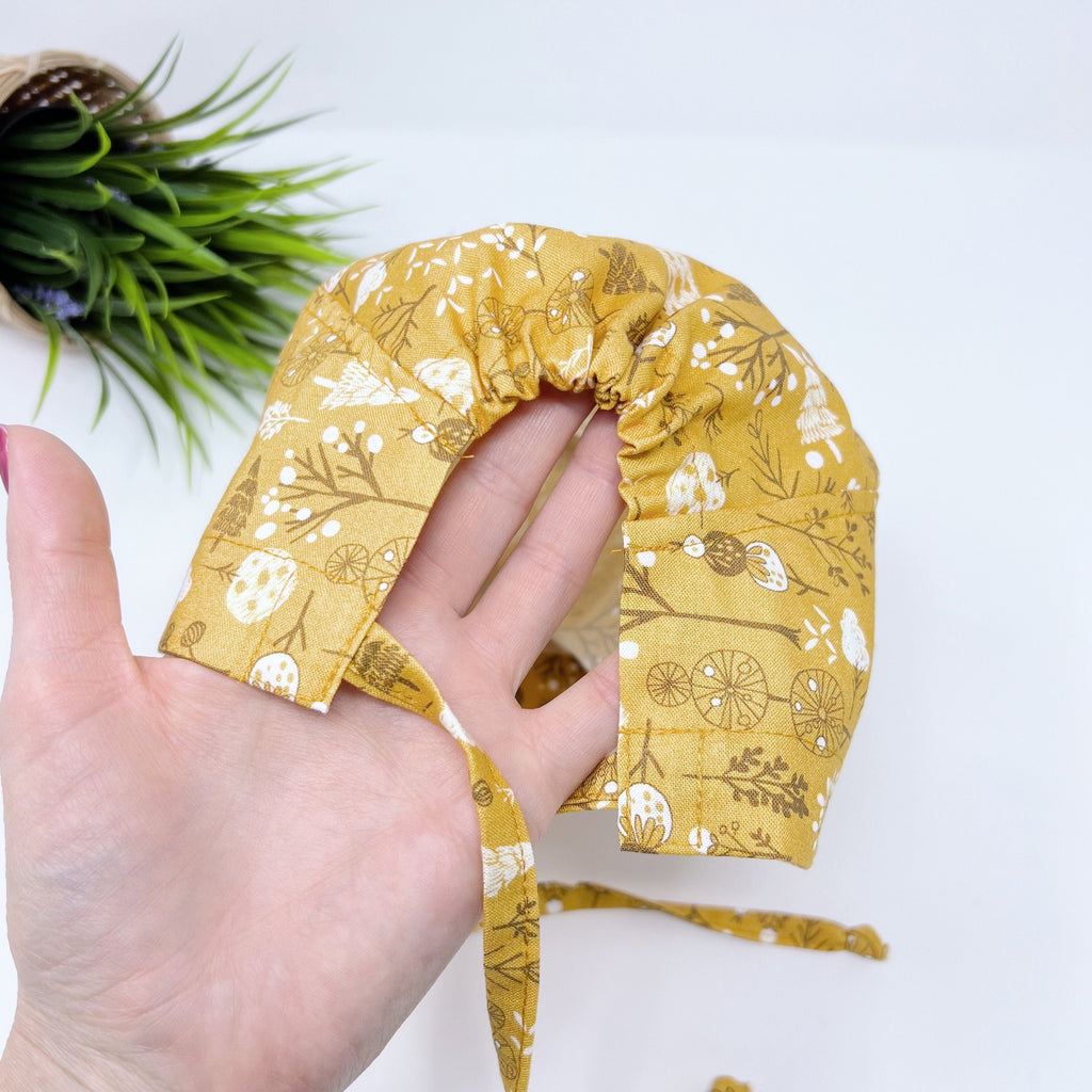 Floral winter Skull tie-back style surgical scrub cap by Paradise Caps.