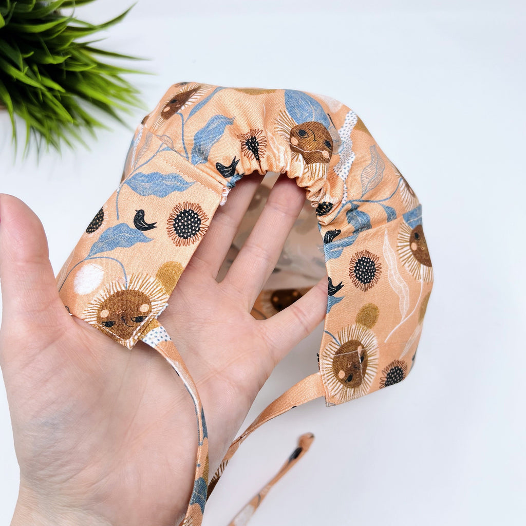 Floral Twirl Skull tie-back style surgical scrub cap for men by Paradise Caps.
