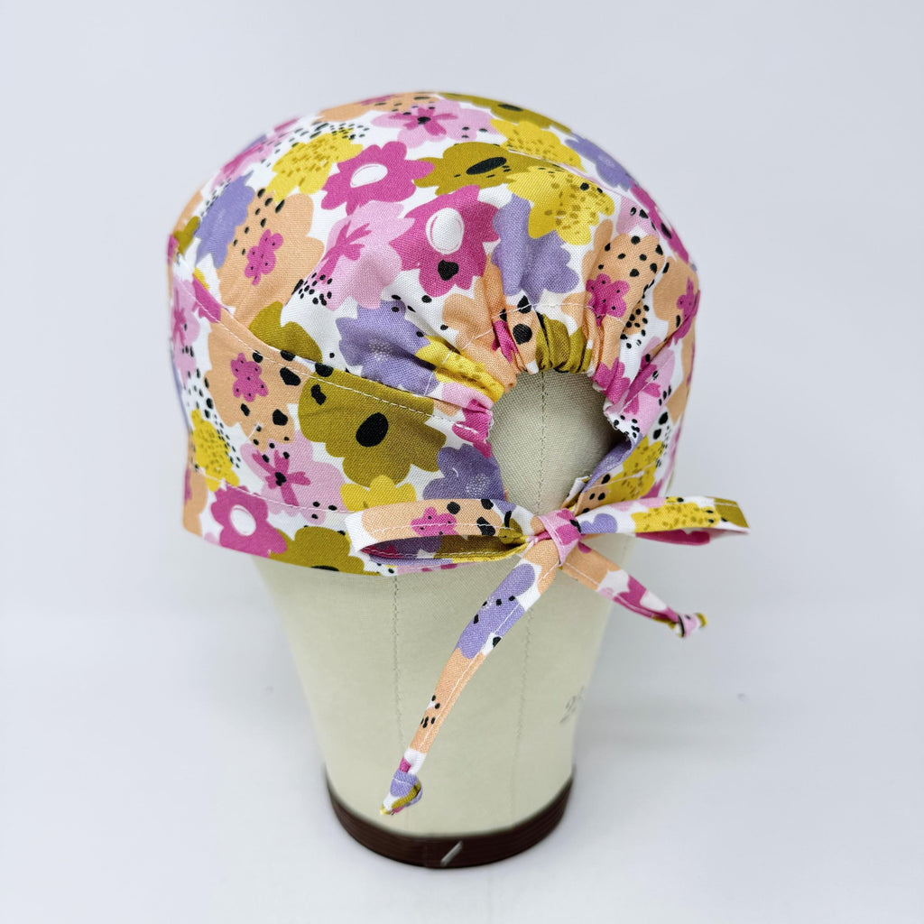Colorful Flower Skull tie-back style surgical scrub cap for men by Paradise Caps.