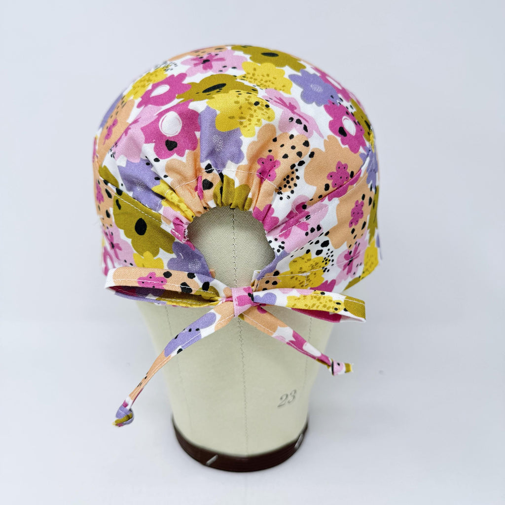 Colorful Flower Skull tie-back style surgical scrub cap for men by Paradise Caps.