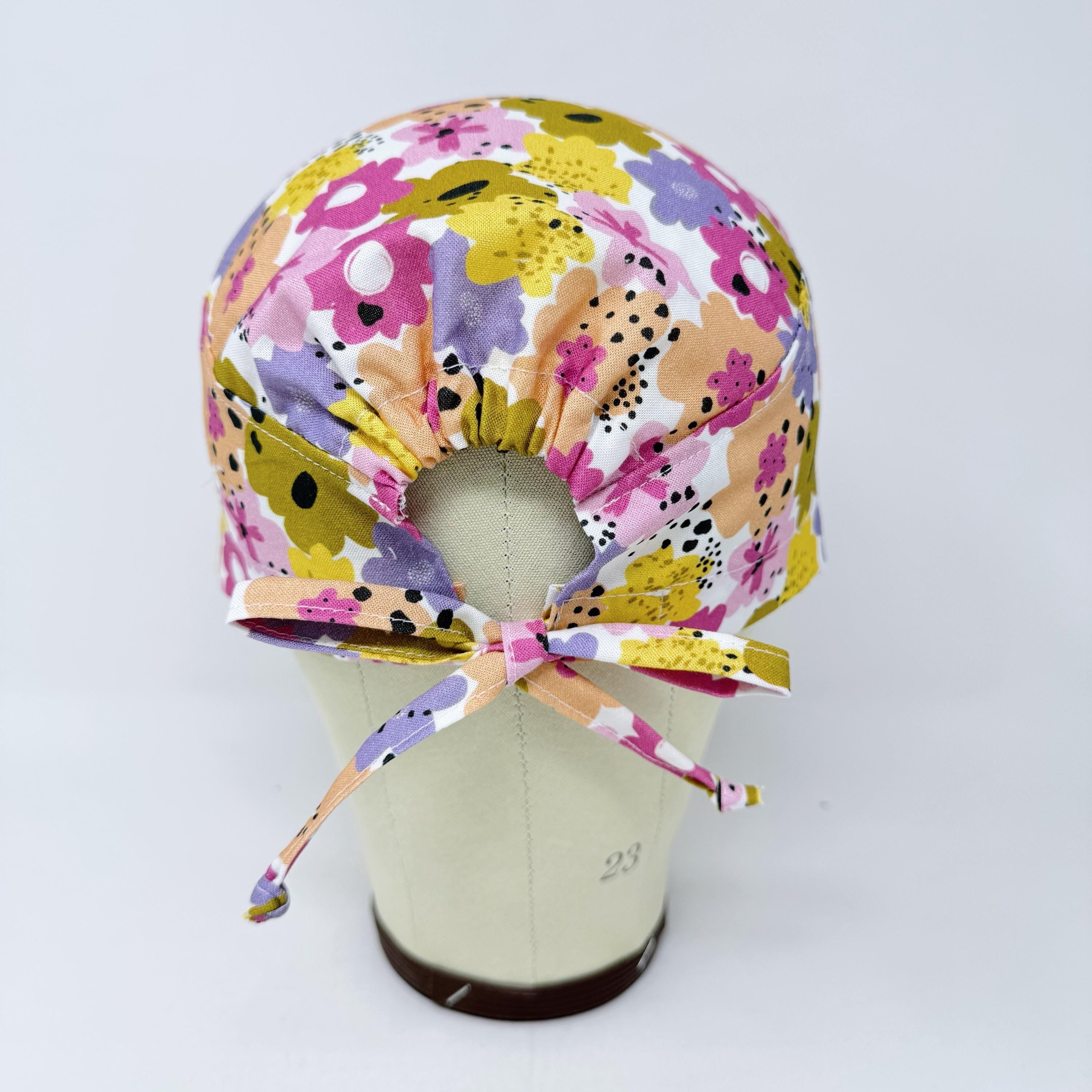 Colorful Flower Skull tie-back style surgical scrub cap for men by Paradise Caps.
