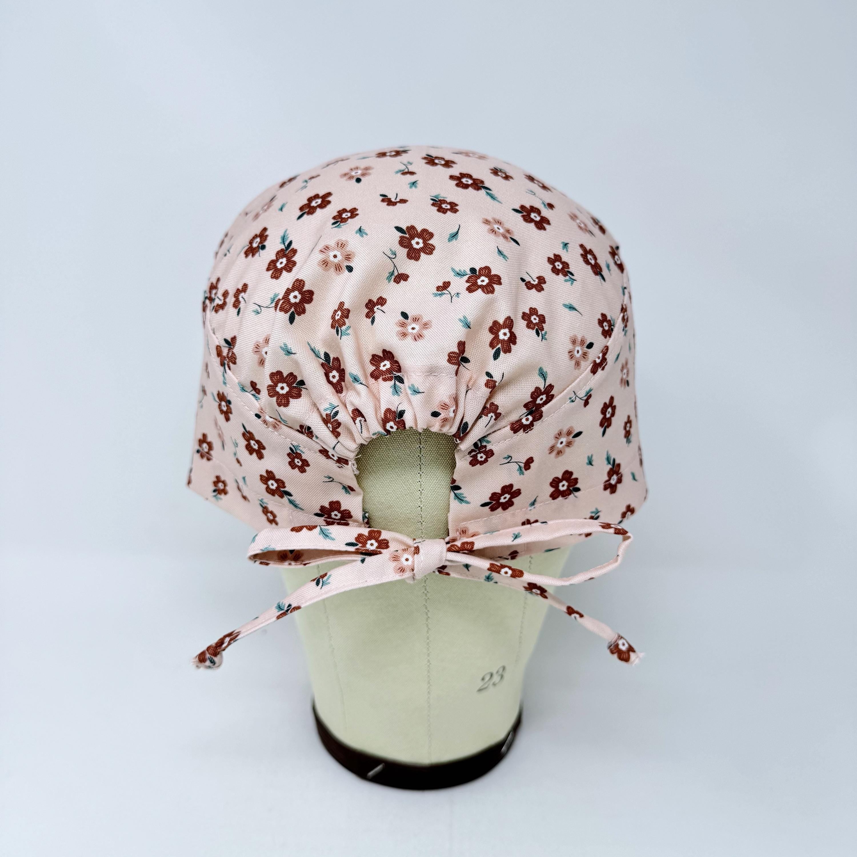 Peach Flower Skull tie-back style surgical scrub cap for men by Paradise Caps.