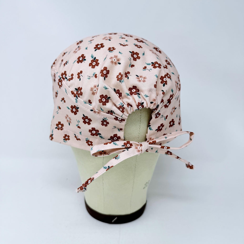 Peach Flower Skull tie-back style surgical scrub cap for men by Paradise Caps.