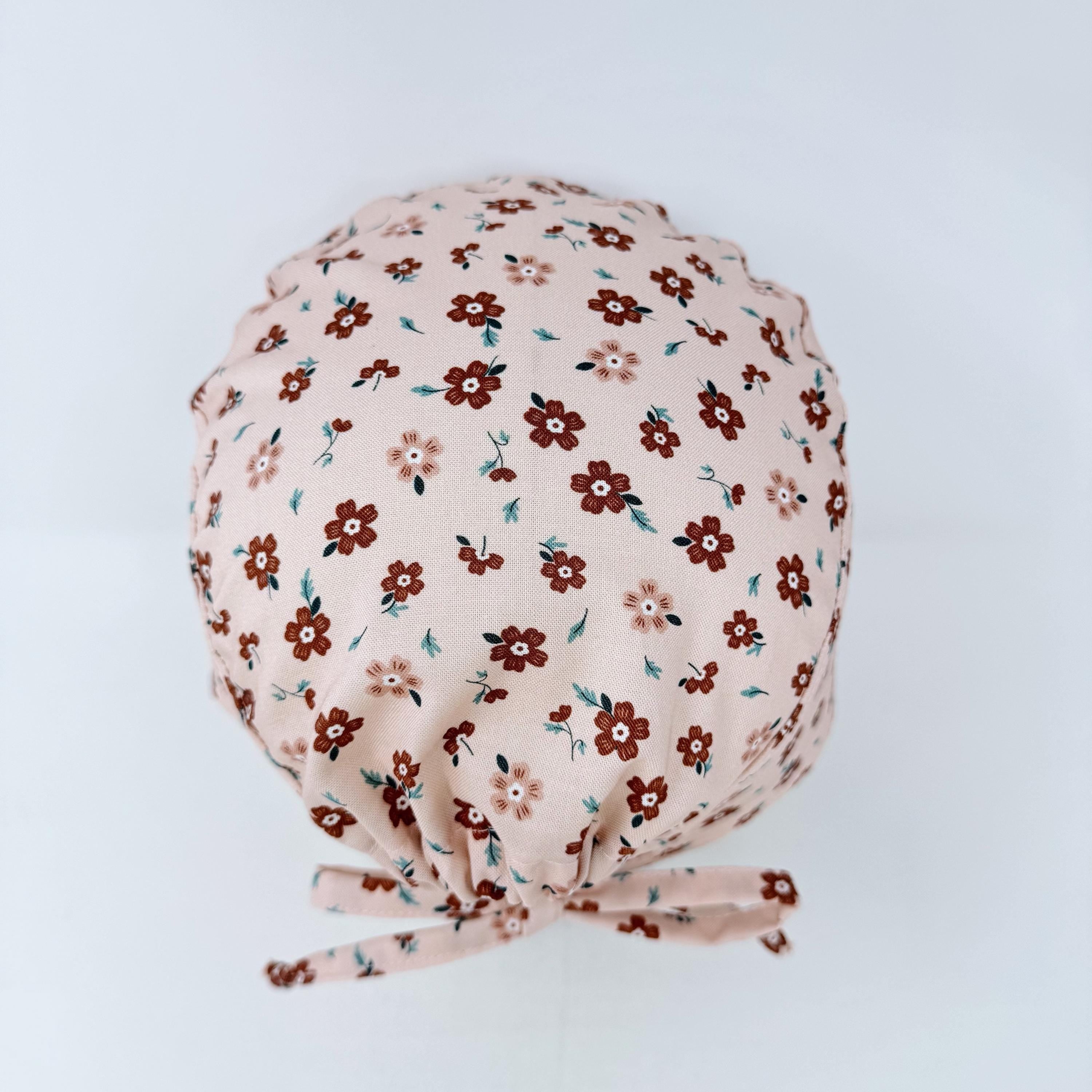 Peach Flower Skull tie-back style surgical scrub cap for men by Paradise Caps.