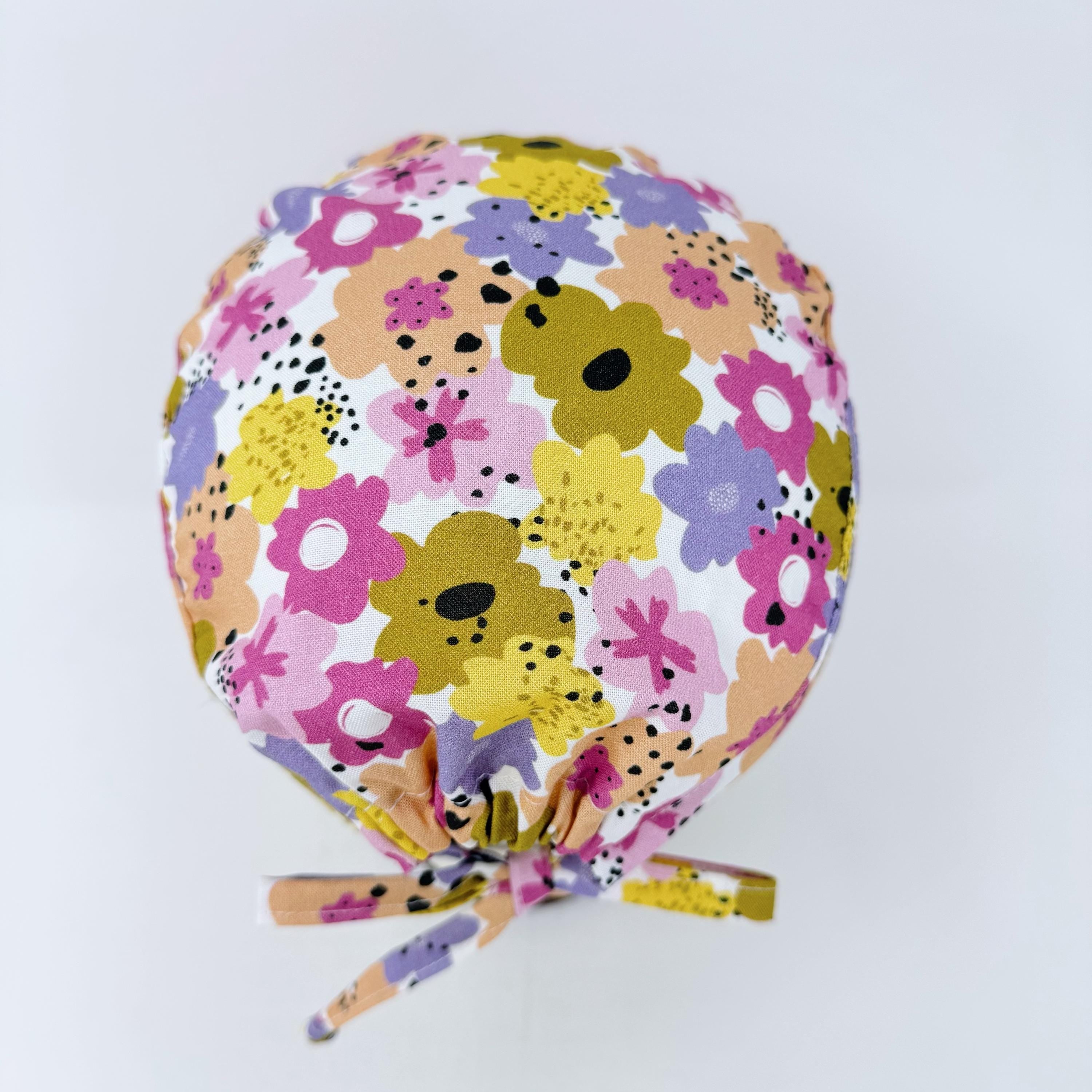Colorful Flower Skull tie-back style surgical scrub cap for men by Paradise Caps.