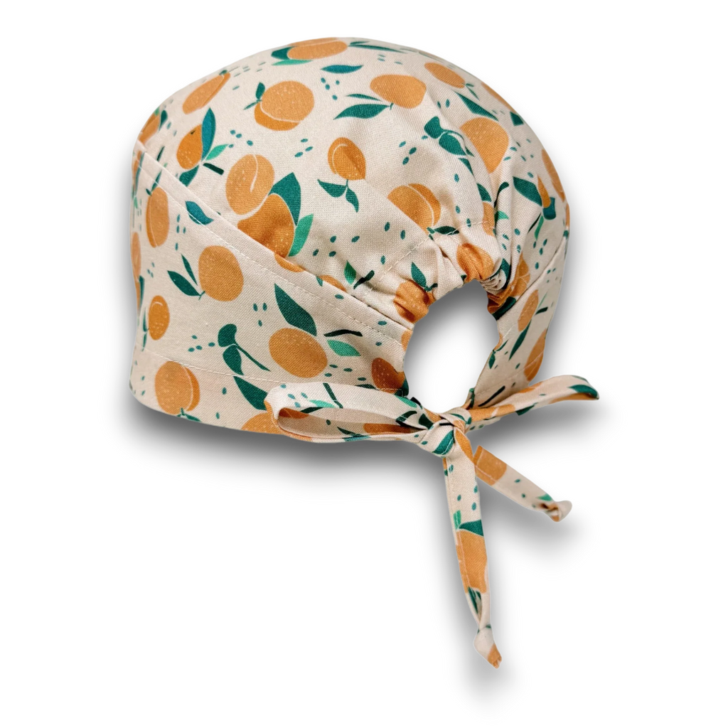 Peach Skull tie-back style surgical scrub cap for men by Paradise Caps.