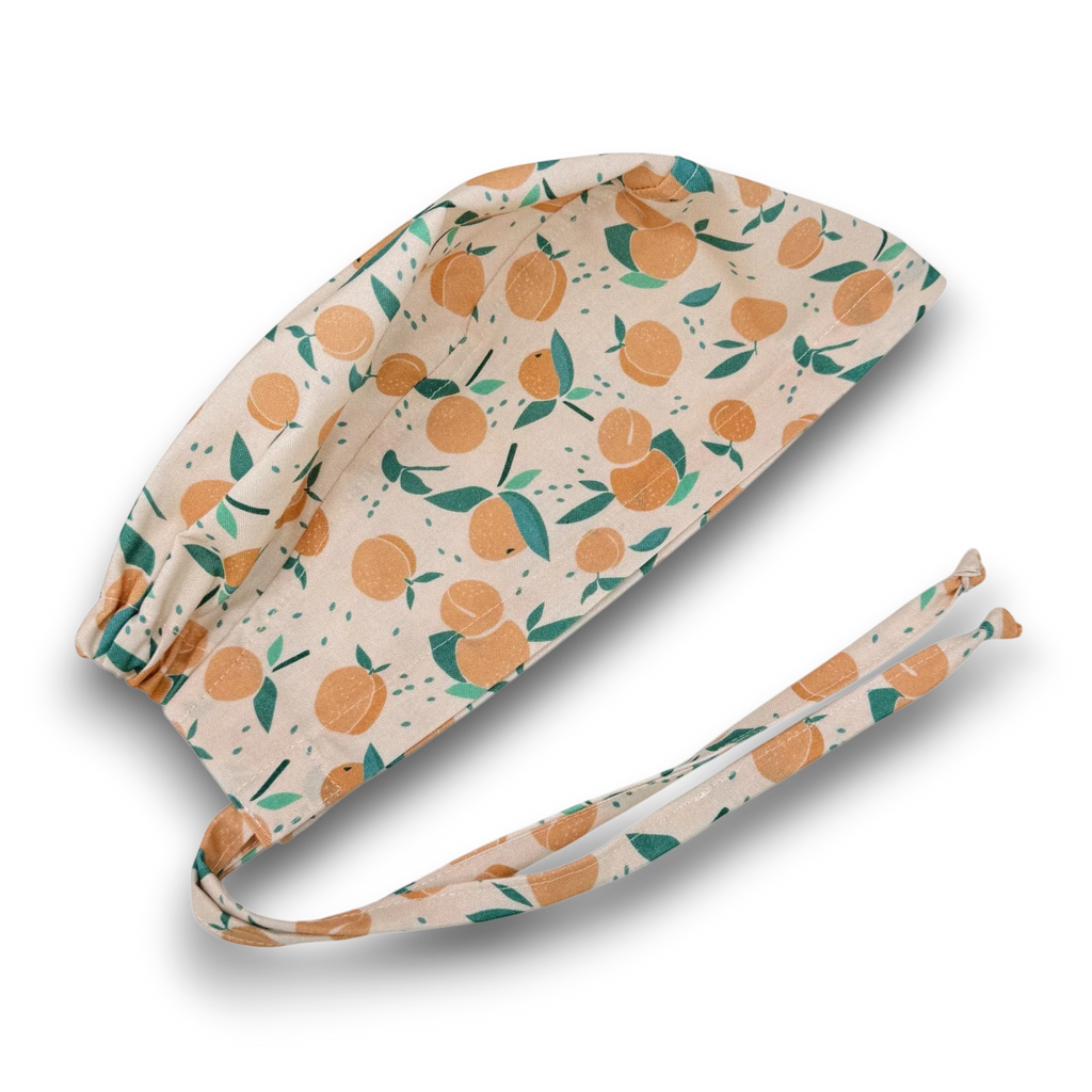 Peach Skull tie-back style surgical scrub cap for men by Paradise Caps.