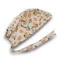 Peach Skull tie-back style surgical scrub cap for men by Paradise Caps.